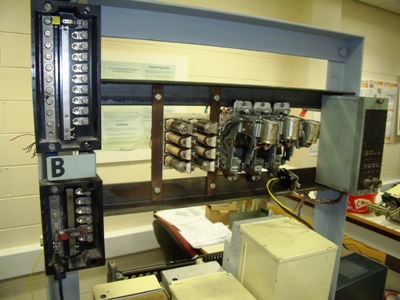 Picture showing the uniselectors and K and LR relays attached to their shelf alongside the fuse panel.